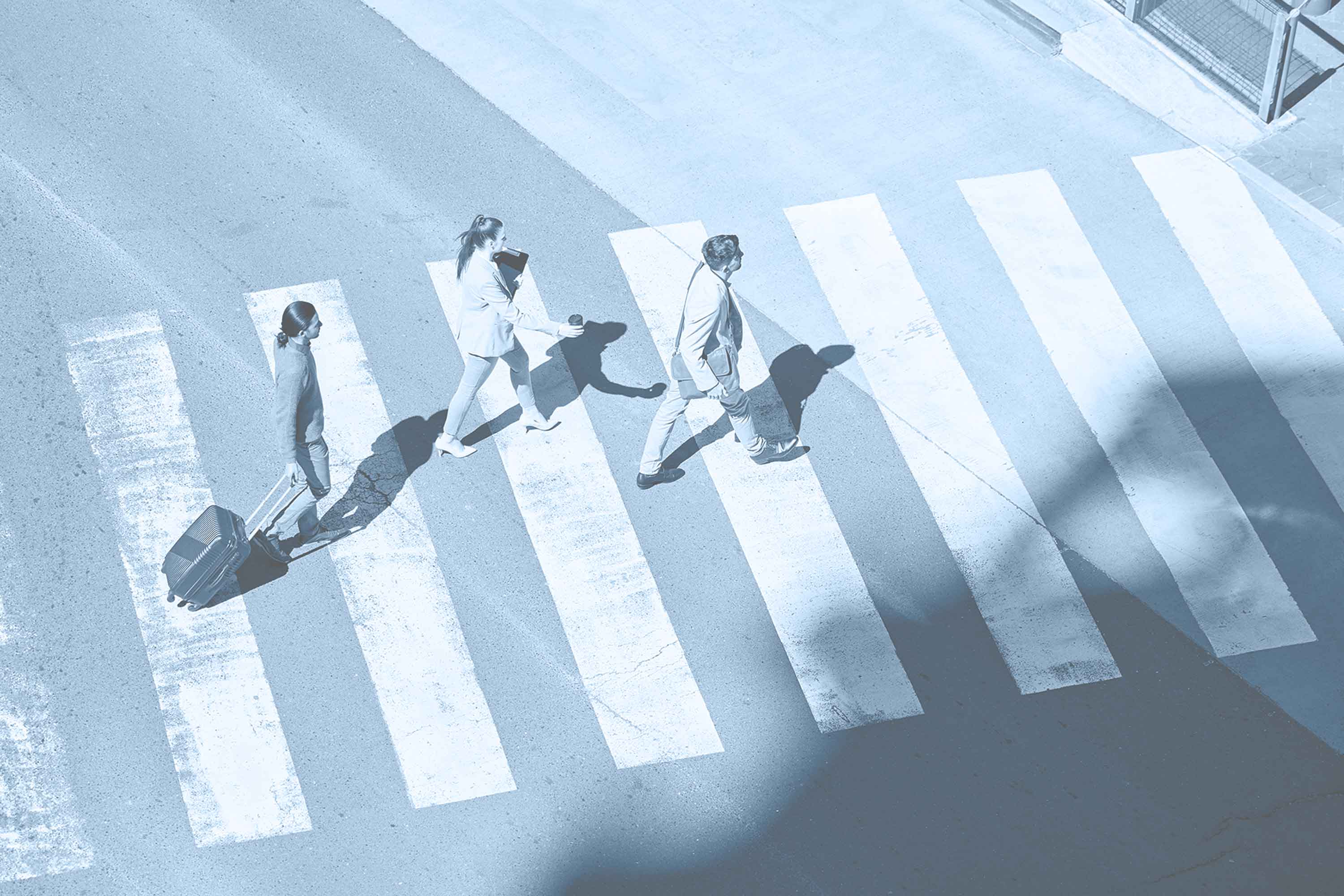 Business people walking across a crosswalk