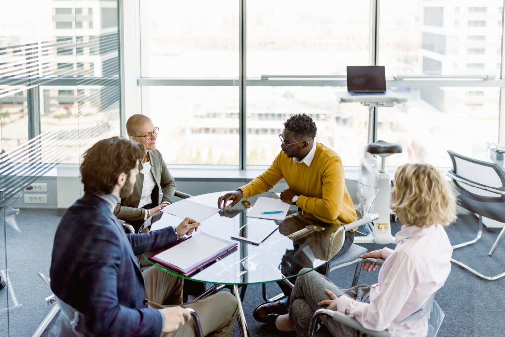 Business leaders making decisions with CEO, legal advisors and investors about future plans