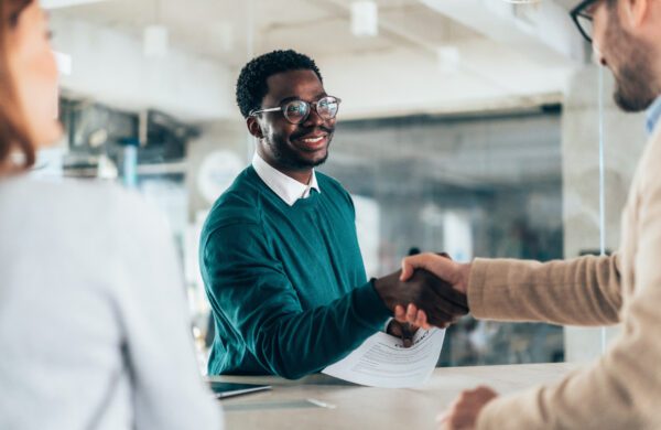 HR manager meets and greets a potential new employee who is being interviewed for the job
