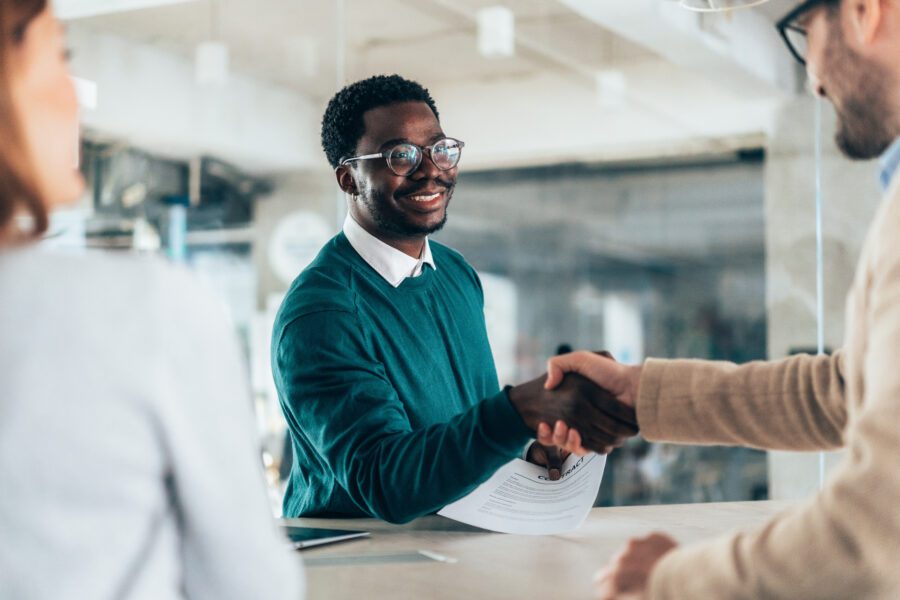 HR manager meets and greets a potential new employee who is being interviewed for the job