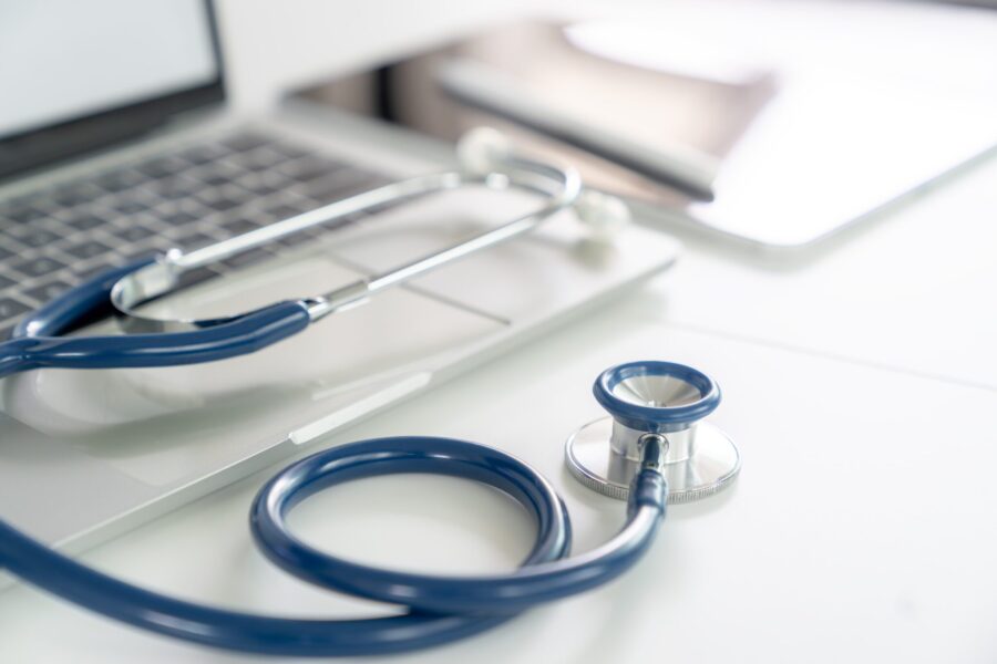 A stethoscope placed on a doctor's desk in a hospital