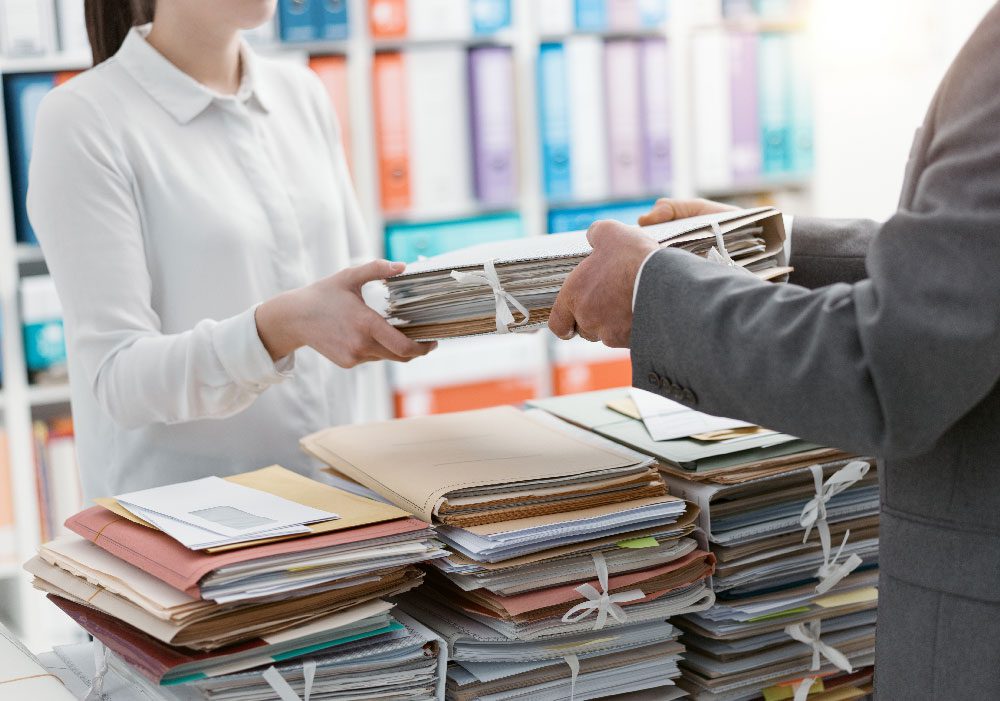 Person handing off files to another party