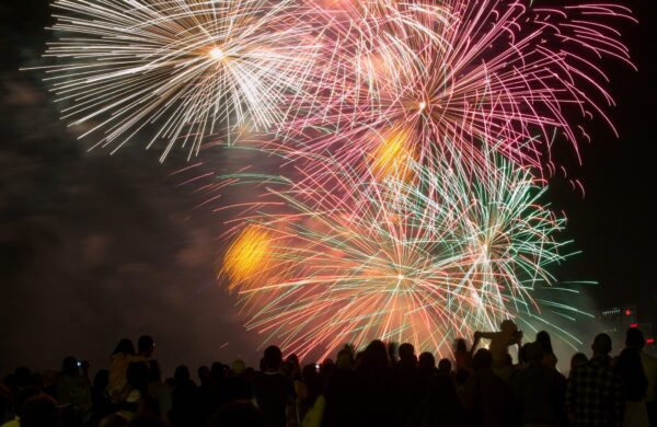 Fireworks Behind a Silhouetted Crowd during a celebration