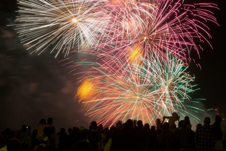 Fireworks Behind a Silhouetted Crowd during a celebration