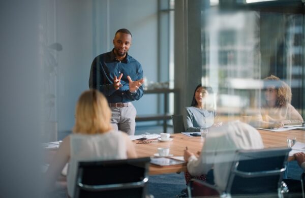Businessman leading an informational session with an interactive presentation in a modern office