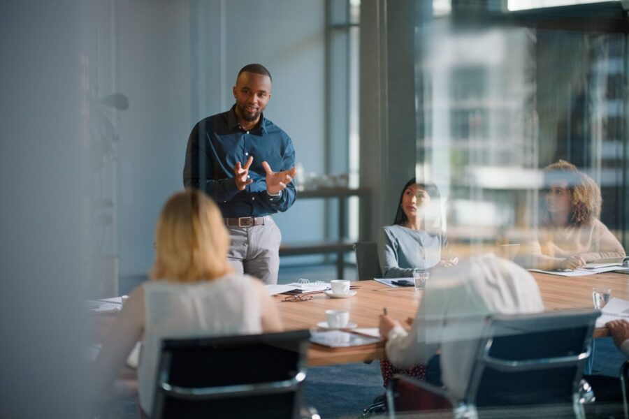 Businessman leading an informational session with an interactive presentation in a modern office