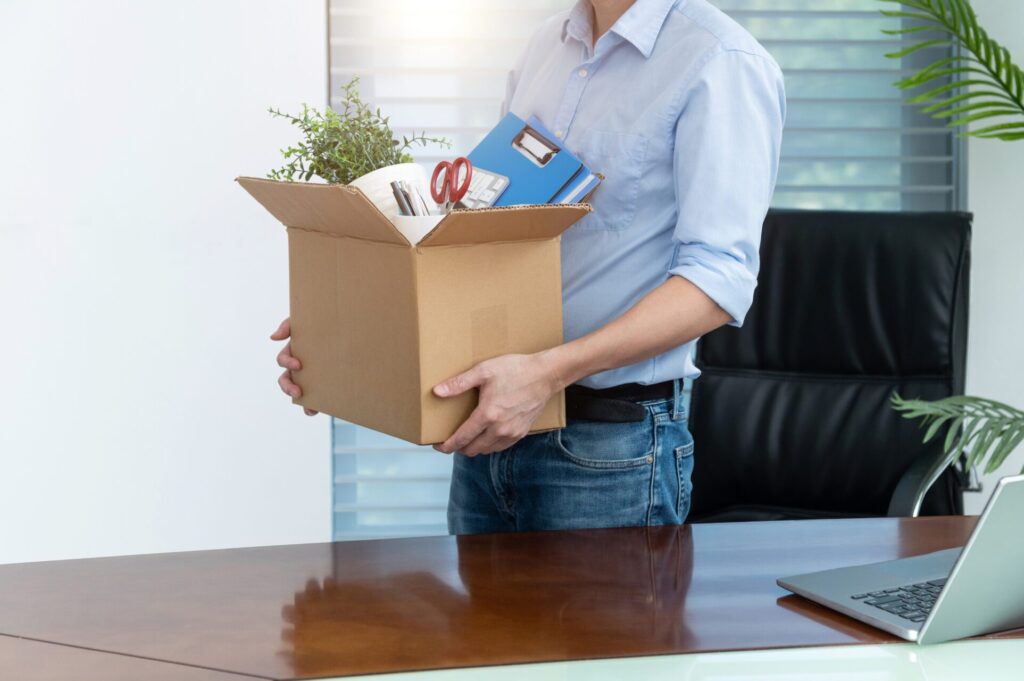 Unemployed man packing his belongings